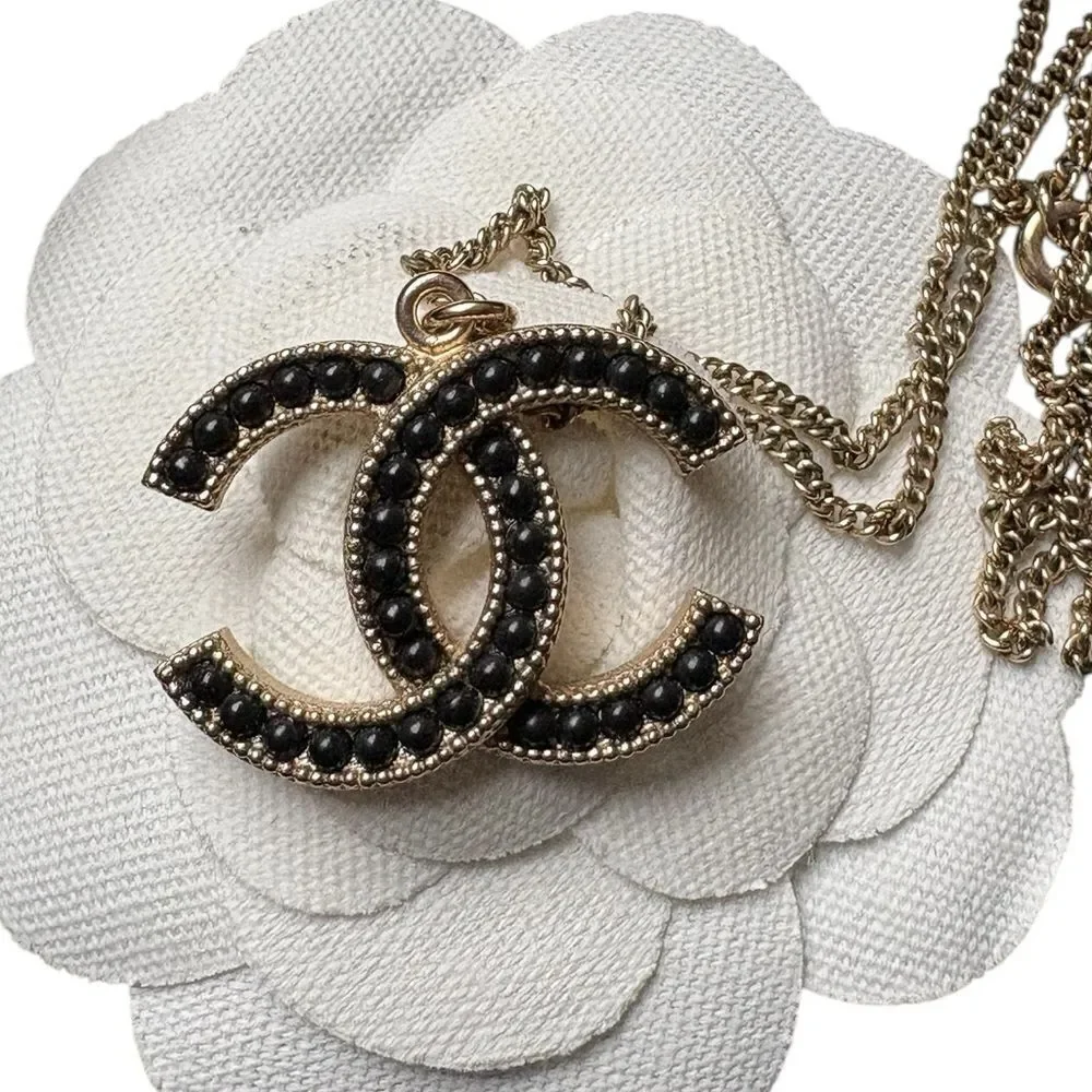 Chanel gold and black pearl CC pendant necklace, Authentic